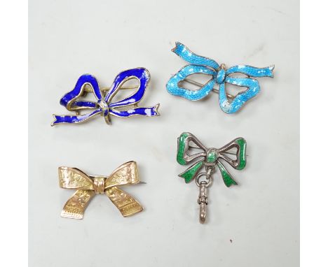 An engraved yellow metal ribbon bow brooch, 26mm, 2.8 grams, together with three silver/gilt white metal and enamel ribbon bo