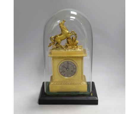 A French mid 19th century gilt mantel clock under dome, striking on a bell, 38 cm high