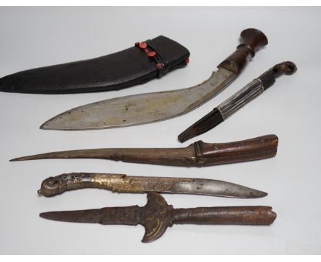 Two Sinhalese daggers and a kukri, a silver inlaid Kirichchiya dagger, together with another in a scabbard with a long pin, a