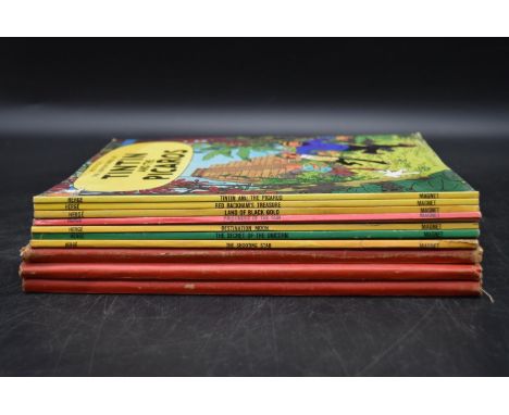 A collecction of ten vintage Tintin comic books.  H.30 W.24cm (10) 