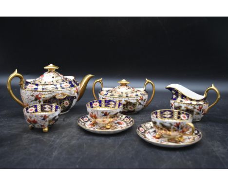 A part set of a handpainted Crown Derby - Old Imari Teaset. Including two cups and saucers, milk jug, coffee pot and teapot. 