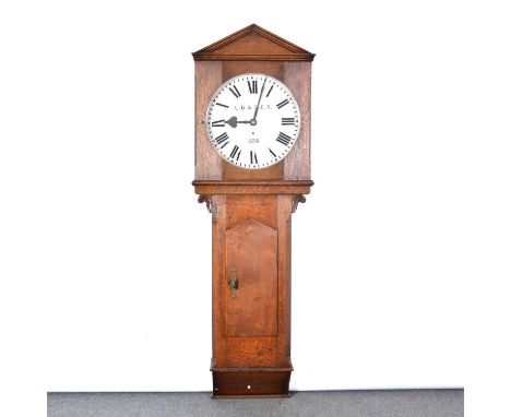 Oak cased Railway regulator longcase wall clock, the hood with architectural pediment, trunk with long door, 18" painted dial