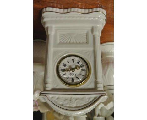 BELLEEK/CERAMIC/IRISH/CLOCKS: A Belleek classic Glenveigh mantle clock. Vine work design.  Measures approx. 19cm high. White 