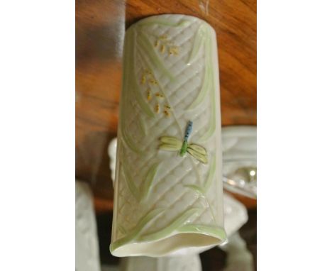 BELLEEK/CERAMIC/IRISH: An unusual Belleek oval column vase with plain cream basket weave background design. Overlain with stu