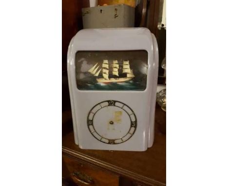 COLLECTABLES - A vintage electric 'Vitascope' automaton clock in Bakelite case, requiring restoration.
