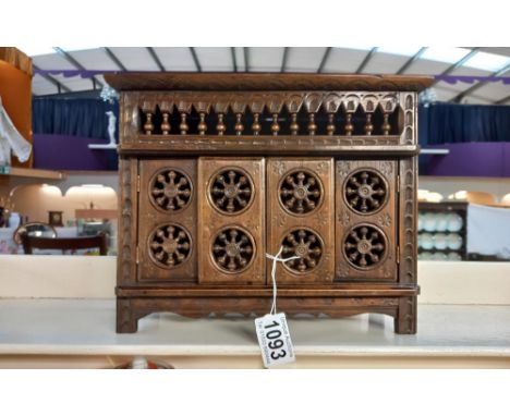 A late 19/early 20c oak Bretton bobbin pokerwork apprentice piece/shop display of a 17c style bread cupboard height 23cm, wid