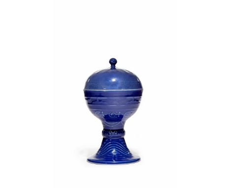 A CHINESE BLUE GROUND ALTAR VASE AND COVER, DOU, SIX CHARACTER GUANGXU MARK AND OF THE PERIOD 1875-1908 The ovoid body raised