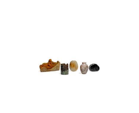 THREE CHINESE JADE SNUFF BOTTLES, QING DYNASTY Two formed from pebbles, the third of plain ovoid form, together with an uncut