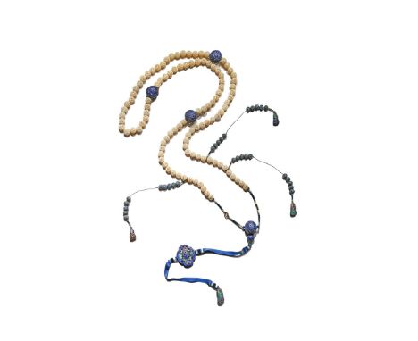 † A CHINESE IVORY AND ENAMEL COURT NECKLACE, CHAOZHU, LATE QING DYNASTY With 105 reticulated ivory beads divided by three lar