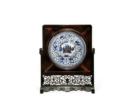 A LARGE CHINESE CIRCULAR BLUE AND WHITE PLAQUE, LATE QING DYNASTY Painted with the Fu Lu Shou standing in a fenced garden, en