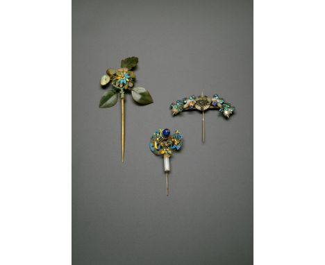 THREE CHINESE HAIR ORNAMENTS, QING DYNASTY One mounted with a pale celadon jade phoenix in flight, flanked by jade and enamel