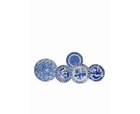 FIVE CHINESE BLUE AND WHITE PLATES, KANGXI 1662-1722 Variously decorated with figures in gardens and a small boat, scrolling 