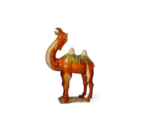 A CHINESE POTTERY MODEL OF A BACTRIAN CAMEL, TANG DYNASTY 618-907 AD Standing with its head thrown back, its mouth open to re