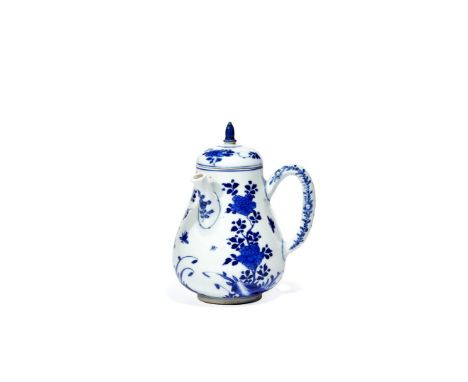 A CHINESE BLUE AND WHITE CHOCOLATE POT AND COVER, KANGXI 1662-1722 The pear-shaped body painted with prunus, peony and chrysa