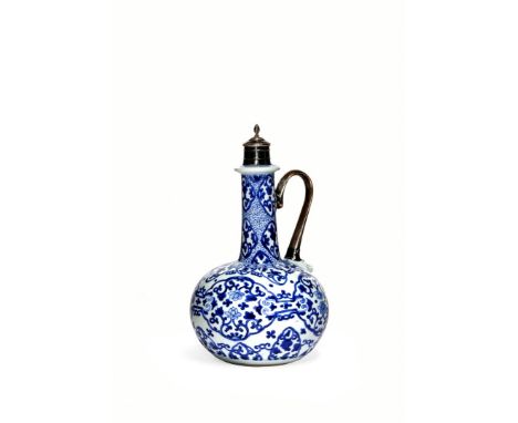 A CHINESE BLUE AND WHITE BOTTLE VASE, KANGXI 1662-1722 The ovoid body rising to a tall cylindrical neck, decorated with an in