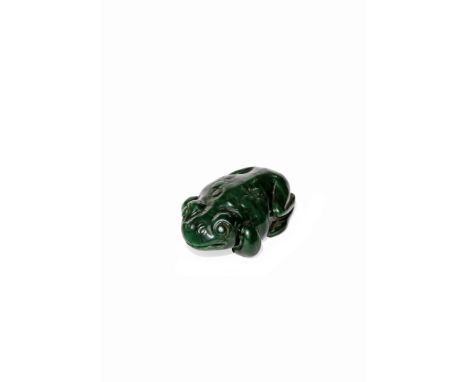 A CHINESE SPINACH-GREEN JADE MODEL OF A TOAD, QING DYNASTY Crouching with its elongated toes tucked beneath its body, the sto