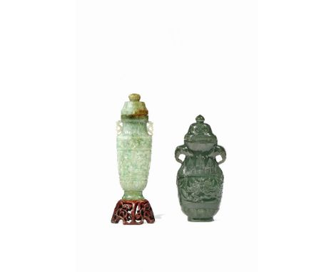 TWO CHINESE JADE ARCHAISTIC VASES AND COVERS, LATE QING One in jadeite, carved in shallow relief with taotie masks, lappets a