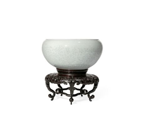 A CHINESE OVOID RICE-GRAIN BOWL, 18TH CENTURY The compressed circular body decorated with a delicate design of four flowerhea