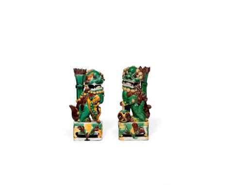 A MATCHED PAIR OF CHINESE FAMILLE VERTE MODELS OF BUDDHIST LION DOGS, KANGXI 1662-1722 The male with its forepaw resting abov