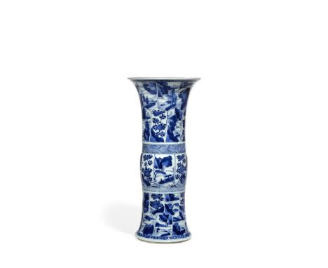 A CHINESE BLUE AND WHITE GU BEAKER VASE, KANGXI 1662-1722 Painted with many panels, containing mountainous landscapes, small 