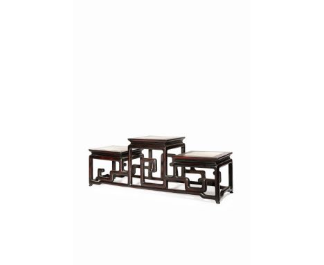 A CHINESE HARDWOOD STAND, 19TH/20TH CENTURY With three square tops, each inlaid with a marble panel and raised on legs joined