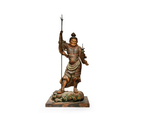 A LARGE JAPANESE WOOD CARVING OF BISHAMONTEN, 19TH CENTURY The god of war standing on a jaki (demon figure), holding a triden