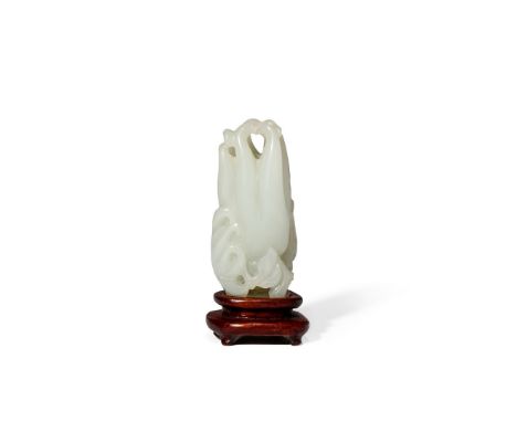 A CHINESE PALE CELADON JADE CARVING OF A FINGER CITRON, 18TH/19TH CENTURY With smaller fruits and leaves issuing from the ste