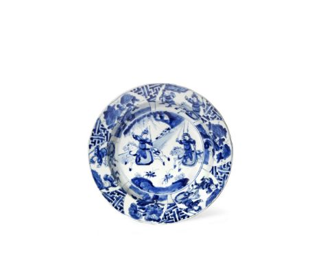 A CHINESE BLUE AND WHITE DISH, SIX CHARACTER KANGXI MARK AND OF THE PERIOD 1662-1722 Painted to the well with two warriors on