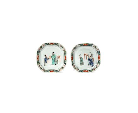 A PAIR OF CHINESE OCTAGONAL FAMILLE VERTE DISHES, KANGXI 1662-1722 One depicting a gentleman giving a gift to a lady before a