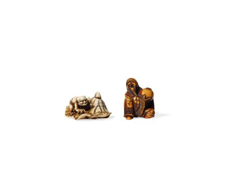 † TWO JAPANESE IVORY NETSUKE, 19TH CENTURY One depicting a small oni on a large lotus leaf trying to catch a catfish hidden b
