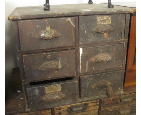 Vintage stained pine table top toolbox with a bank of six drawers containing various tools, chisels, scissors, brass accessor
