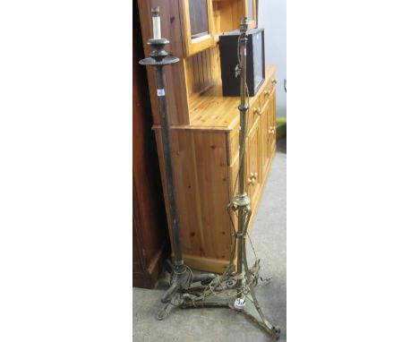 Brass extending standard lamp on scroll decorated base together with another cast metal lamp on claw feet. (2) (B.P. 24% incl