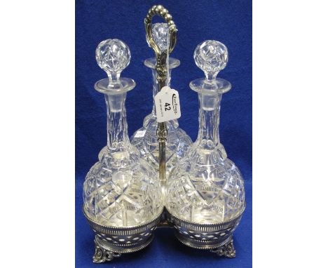 Silver plated three section decanter stand with graduated bobbin handle, raised on scroll type feet, containing three thumb s