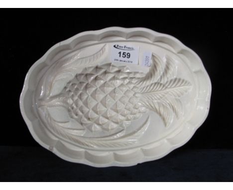 Ceramic pineapple jelly mould.(B.P. 24% incl. VAT)   CONDITION REPORT:  2 chips around rim , crazing, otherwise OK.  25 x 18 