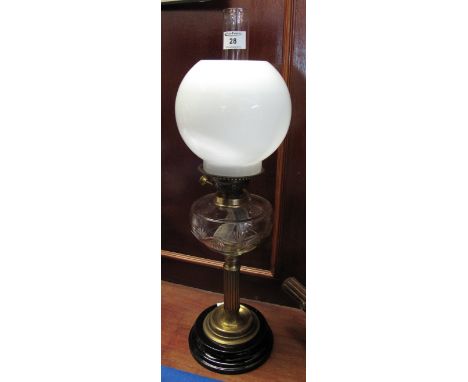 Early 20th Century double burner brass column oil lamp with cream shade and clear funnel.(B.P. 24% incl. VAT)
