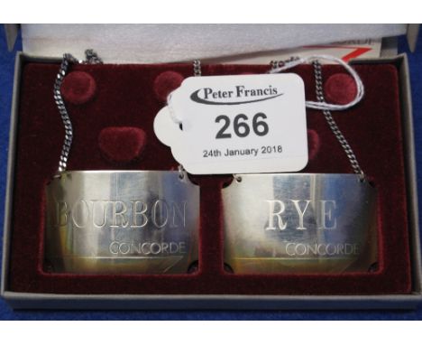 Cased pair of silver Concorde decanter labels, Bourbon and Rye.(B.P. 24% incl. VAT)