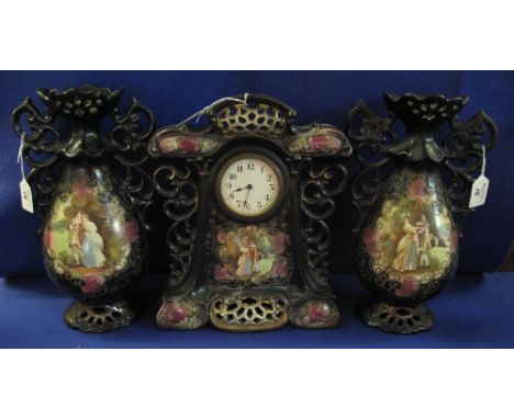 Victorian pottery three piece clock garniture comprising pair of twin handled vases and mantel clock, overall decorated with 