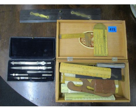 A selection of wooden rulers and a geometry set to include two rope rules 