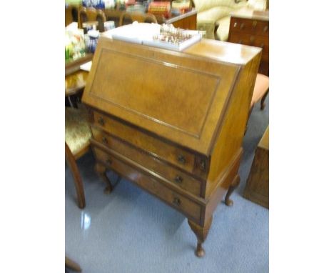 A mid 20th century Queen Anne inspired, walnut, three drawer bureau, raised on cabriole legs, 40" h x 29", along with a mid 2