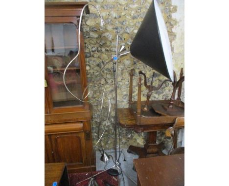 A pair of Italian flexible standard lamps and a chrome standard lamp with a large black shade, each with two pin plugs 