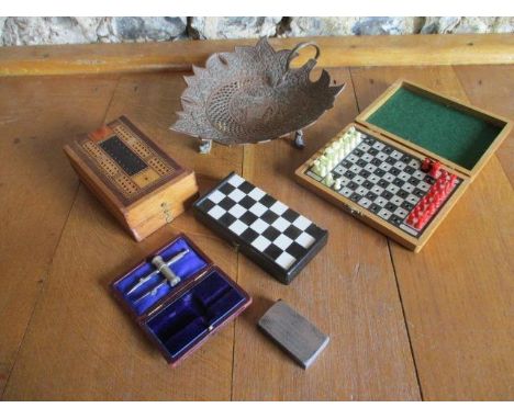 A Persian copper footed dish with handle, together with a vintage cribbage box, two small chess sets, a printing block and a 