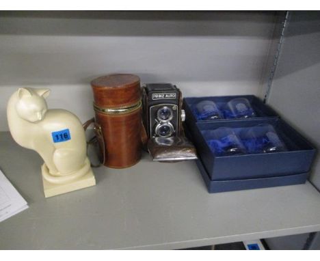 A mixed lot to include an Auto prinz camera, a three piece carrying drinks set, a model of a cat and four England Rugby drink