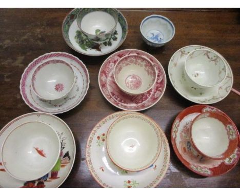 A selection of late 18th century and early 19th century ceramic tea bowls and saucers to include Caughley and Minton, togethe