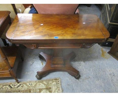 A Regency mahogany rotating, foldover topped card table, raised on scrolled, carved feet, 28"h x 36" w 