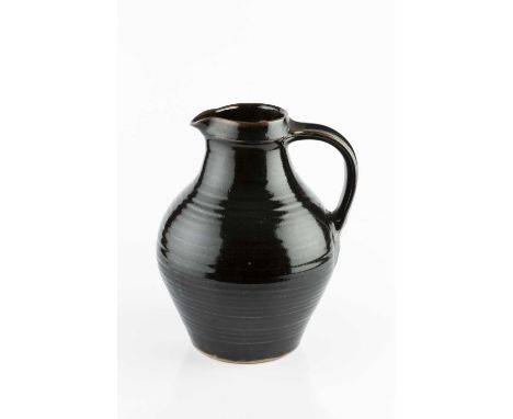 Attributed to David Leach (1911-2005) at Lowerdown PotteryJugtenmokuimpressed pottery seal29cm high; and a jug by Andrew Hagu