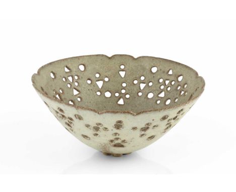 Ian Godfrey (1942-1992)Bowloatmeal glaze, with pierced circles and triangles9cm high, 19cm diameter. Provenance:The Daphne Sw