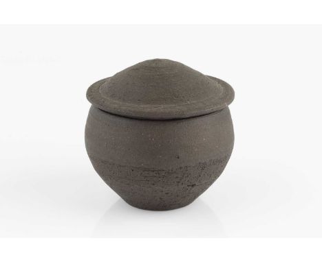 Janet Leach (1918-1997) at Leach PotteryPot and coverwith matte black glazeimpressed potter's and pottery seals11.5cm high.