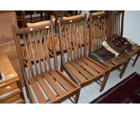 A set of Ercol dining chairs dark stained dining chairs, in a simple style