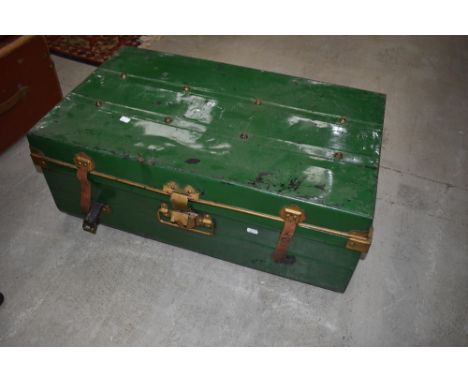 A vintage tin cabin trunk