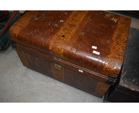 A vintage travel trunk having scumbled style decoration